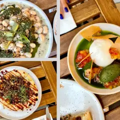 Deliciosos platos para comer en Cracovia: alubias cremosas, pizza y burrata con salsa verde.